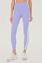 A woman's Miles High Waist Rigor 7/8 in Purple Haze/White by SPLITS59.