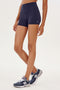 A woman wearing a SPLITS59 Airweight High Waist 3.5” Short designed for Pilates.