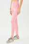The back view of a woman in SPLITS59 Airweight High Waist Legging - Dusty Rose leggings.