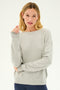 A person with blonde hair wearing the Sonja Fleece Sweatshirt in Heather Grey by SPLITS59 and dark pants, made in Los Angeles with ultra luxe fleece, stands against a plain background.