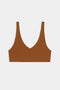 The SPLITS59 Airweight Scoop Back Bra in brown, featuring wide shoulder straps and a seamless design, is displayed flat on a white background.