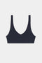 The SPLITS59 Airweight Scoop Back Bra in navy blue features a wireless, seamless design with wide straps and a deep V-neckline, displayed on a plain white background.