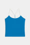 The Airweight Tank by SPLITS59 is a blue camisole top with white spaghetti straps and trim, shown against a plain white background.