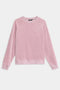 The SPLITS59 Joy Velour Crewneck, a light pink long-sleeve sweatshirt, is displayed laid flat on a white background.