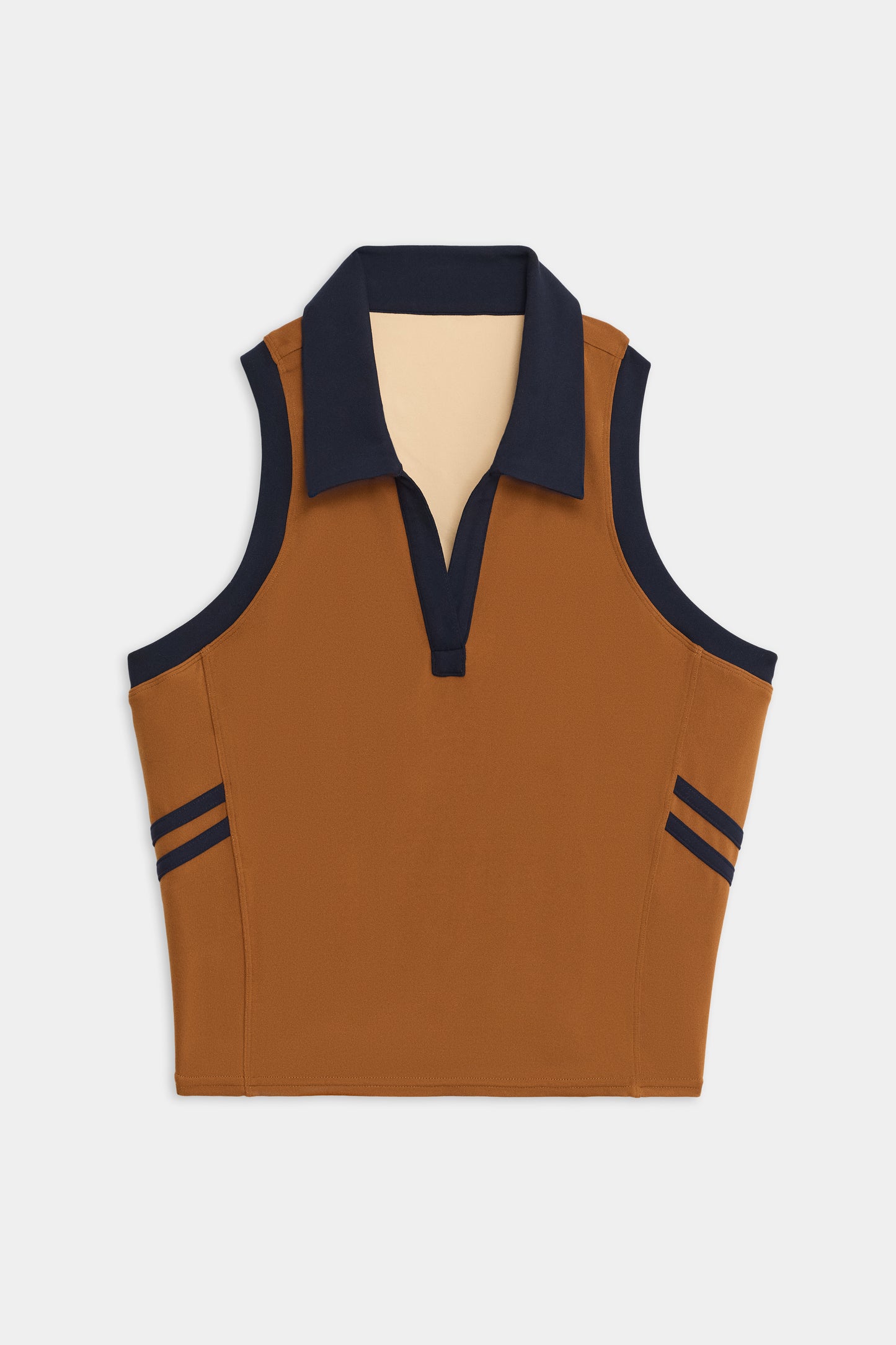The SPLITS59 Austin Airweight Crop Polo, a sleeveless brown top with a navy collar and side stripes, is shown laid flat on a white background.