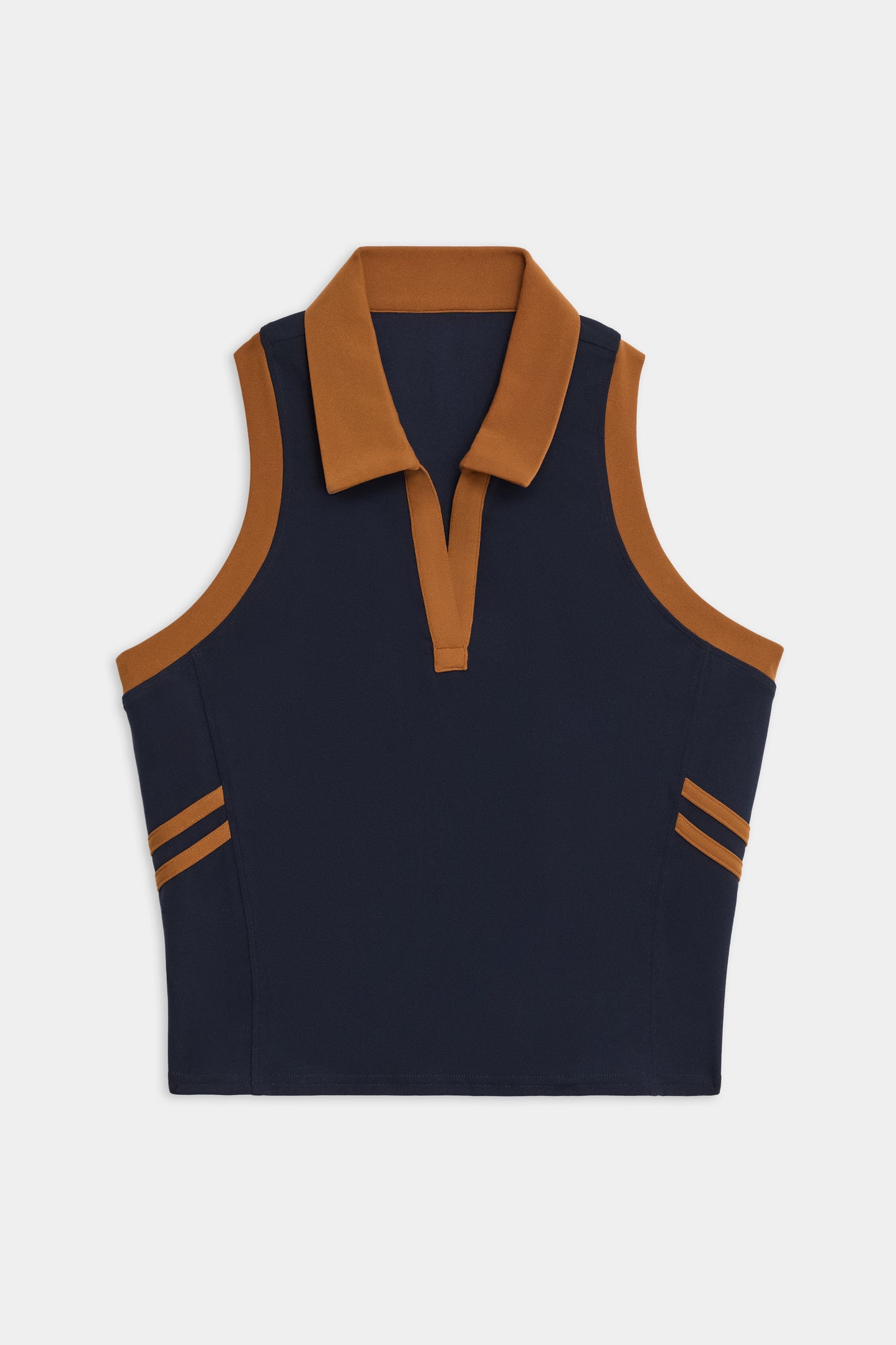 The SPLITS59 Austin Airweight Crop Polo is a sleeveless navy top with a brown collar, brown shoulder trim, and two brown stripes on each side near the hem.