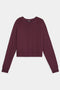 The SPLITS59 Brooks Fleece Long Sleeve Sweatshirt, a maroon crew-neck cropped style, is displayed laid flat against a white background.