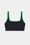 The SPLITS59 Cait Rigor Bra in Black/Grass features a square neckline and green trim, made from high performance Rigor fabric for high impact workouts. Shown on a white background.