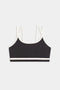 The SPLITS59 Eva Rigor Double Strap Bra, featuring a black design with white trim and double thin shoulder straps, is displayed on a plain white background.