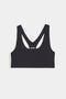 Flat view of dark grey sports bra with a thin white and black stripes down the side
