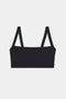 The Monah Rigor Bra - Black by SPLITS59 is a black bralette that features wide straps and exudes a retro sport style from the front view, all set against a plain white background. It's perfect for both workouts and casual wear.
