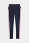 The Margot Rigor Legging by SPLITS59 features a navy blue design with a wide waistband and vertical pink and white stripes along the sides.