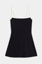 The Monah Rigor Dress by SPLITS59 features a black mini dress with a flared skirt, square neckline, and thin white straps and trim against a plain white background.
