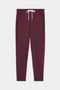 The SPLITS59 Reena Fleece 7/8 Sweatpant, in maroon with side pockets and a white drawstring waistband, is displayed flat on a white background.