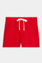 The SPLITS59 Reena Sweatshort is a red pair of shorts with an elastic waistband, white drawstring, and two side pockets, shown against a white background.