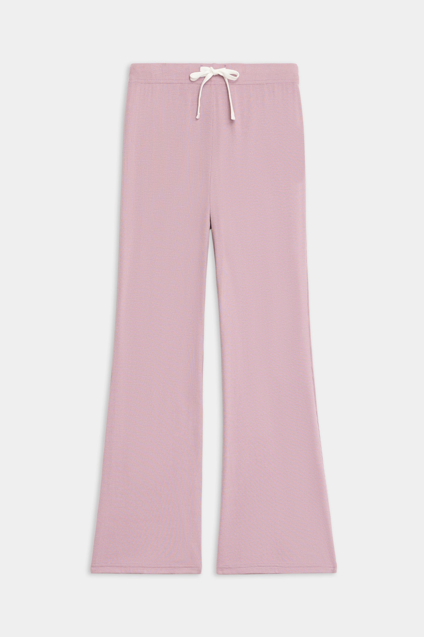 The SPLITS59 Blaire Rib Pant features a light pink, wide-leg knit design with an elastic waistband and white drawstring, shown laid flat on a plain white background.