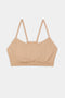 A Loren Seamless Bra in Nude on a white background from Splits59.