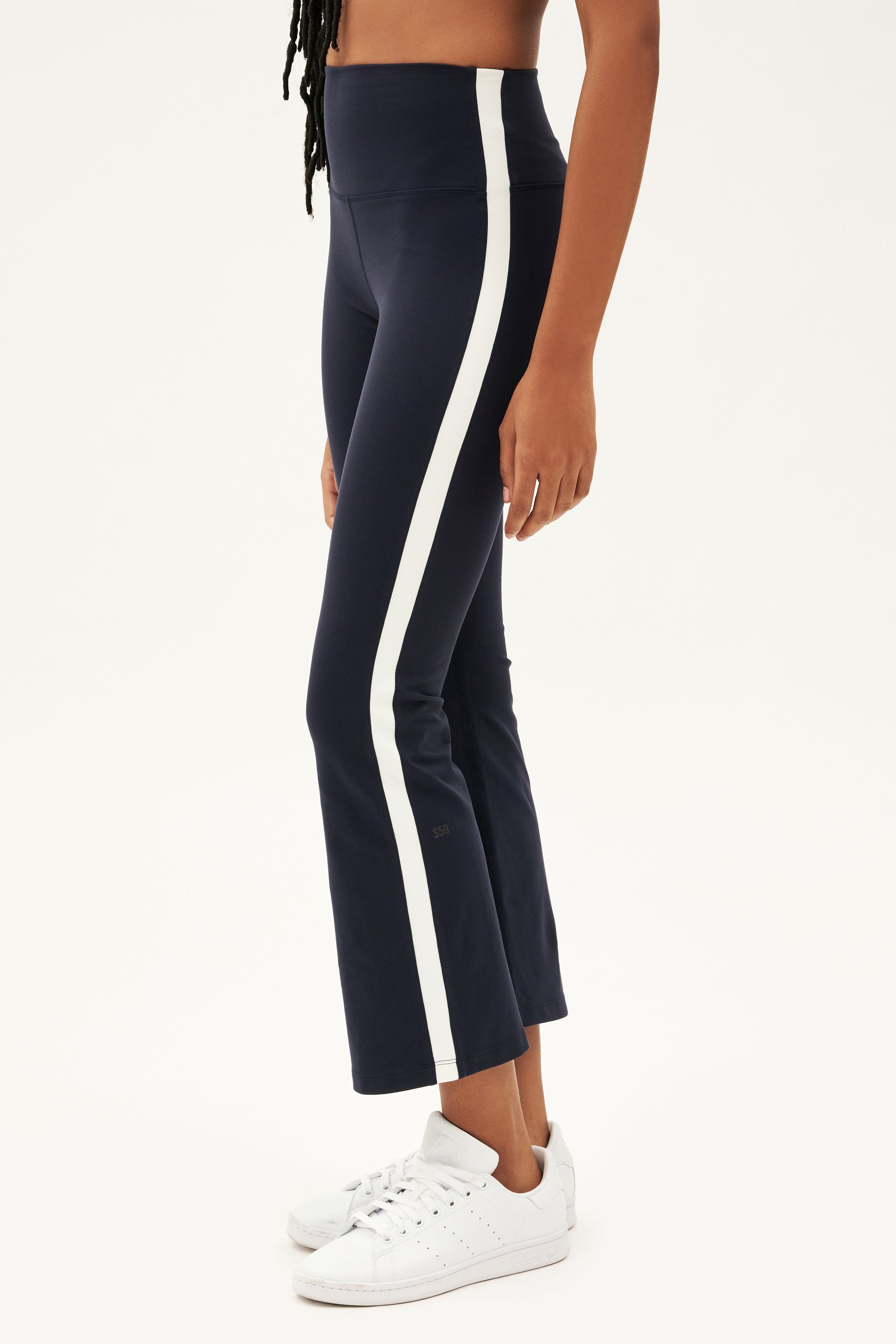 A woman wearing high waist Raquel navy and white stripe leggings made from 4-way stretch supplex fabric.
Product Name: SPLITS59 Raquel High Waist Crop - Indigo/White