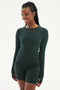 A woman in a SPLITS59 Louise Rib Long Sleeve - Military and athletic wear smiling at the camera.