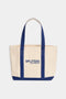 Beige heavyweight Canvas Tote Bag - White/Navy with reinforced blue handles and 'Tropic of C' branding on the front.