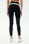A person is seen from behind wearing SPLITS59 Emerson Airweight High Waist leggings in Black/Ice, featuring a light blue and white waistband—ideal for Pilates or hot yoga—posed against a white background.