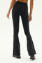 A person wearing the Raquel High Waist Flared Legging in Black/Grass by SPLITS59, complemented with black shoes, stands against a plain background. The leggings offer 4-way stretch, making them ideal for workouts.
