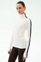 A woman models the SPLITS59 Jackson Rib Full Length Turtleneck in White/Dark Chocolate with matching leggings, ideal for running or yoga, against a plain white background.