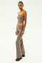 A person wearing the SPLITS59 Raquel Airweight Foldover Flare in Lentil, posing against a plain background.