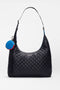 The SPLITS59 MZW x Splits59 Carry All is a black quilted shoulder bag featuring a curved strap and a small, round blue-and-red coin pouch attached to the handle.
