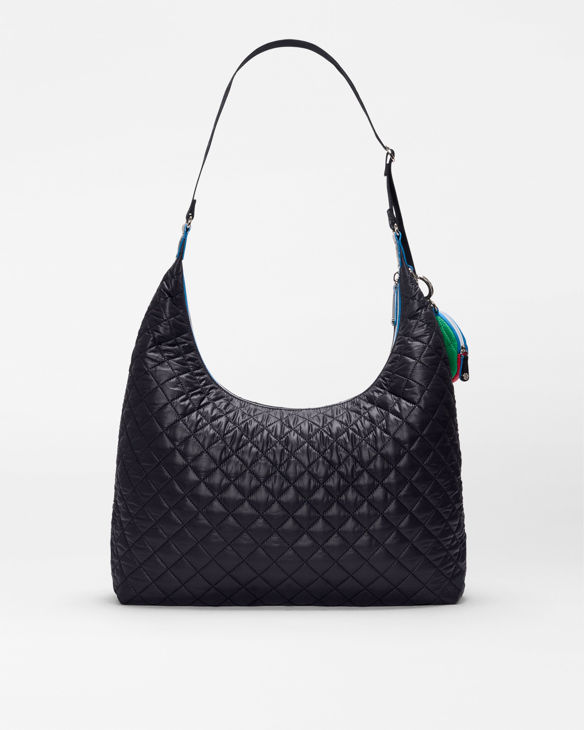 The SPLITS59 MZW x Splits59 Carry All is a black quilted shoulder bag with a curved top, single strap, and small colorful accents by the side zipper, shown on a plain white background.