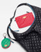 The SPLITS59 MZW x Splits59 Carry All, featuring a black quilted shoulder bag with blue zipper, a red zippered pouch, and a round green and red coin purse with keyring, is displayed on a white background.