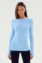 A person with straight hair is wearing a super soft SPLITS59 Louise Rib Long Sleeve in Skylight paired with black pants, facing the camera against a plain background.