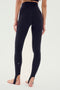 A person wearing the River High Waist Airweight Stirrup leggings in black from SPLITS59 stands barefoot, showcasing the perfect outfit for hot yoga.