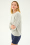 Person standing against a plain background wearing an SPLITS59 Sonja Fleece Sweatshirt in Heather Grey and navy blue shorts MADE IN LOS ANGELES.