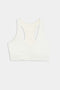 SPLITS59's Airweight Bra with Ruching in white, featuring gathered front detail, is shown against a plain backdrop.