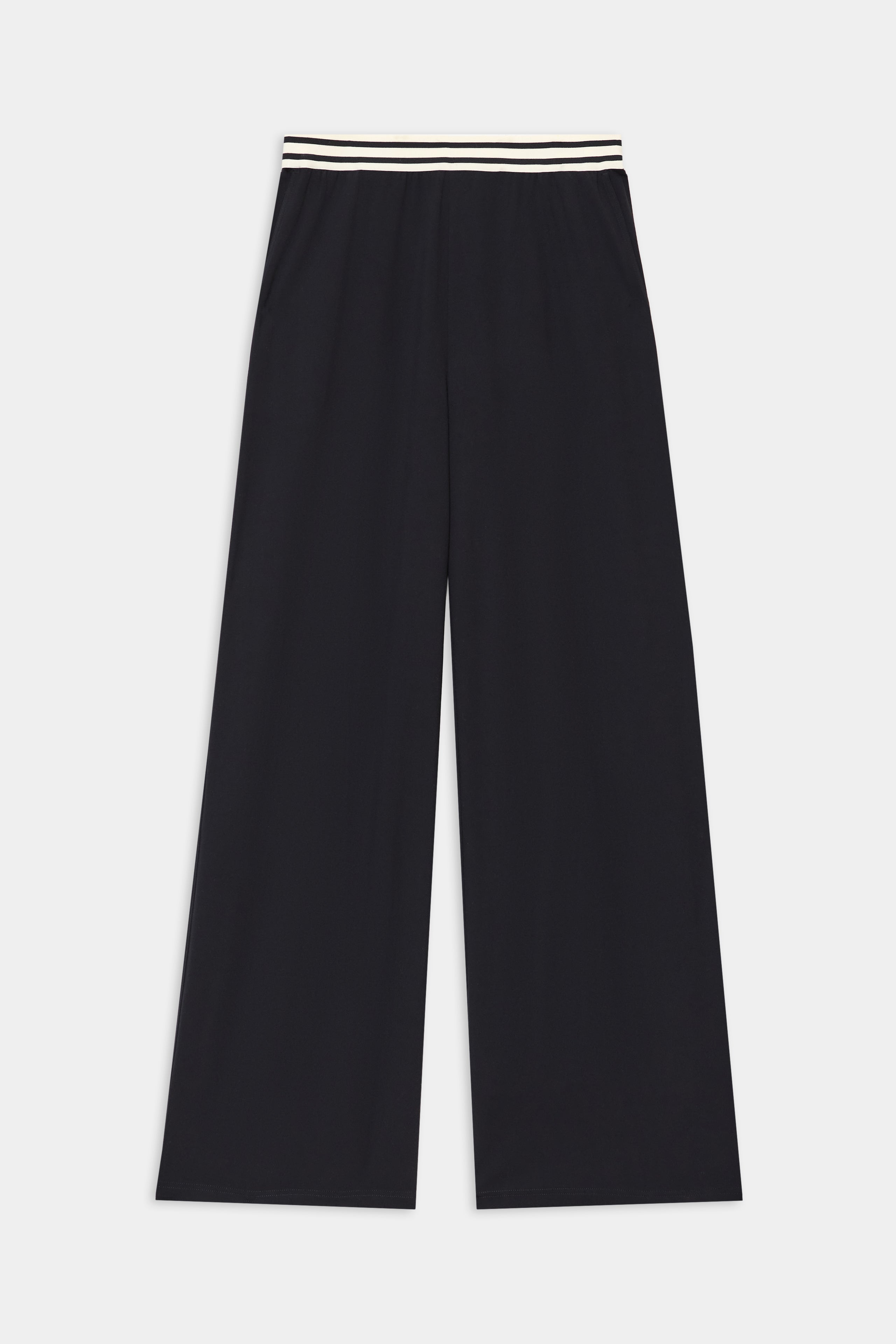 The Michele Airweight Trouser by SPLITS59 is a wide-leg black pant with an elastic waistband and two white stripes, shown laid flat on a plain background.