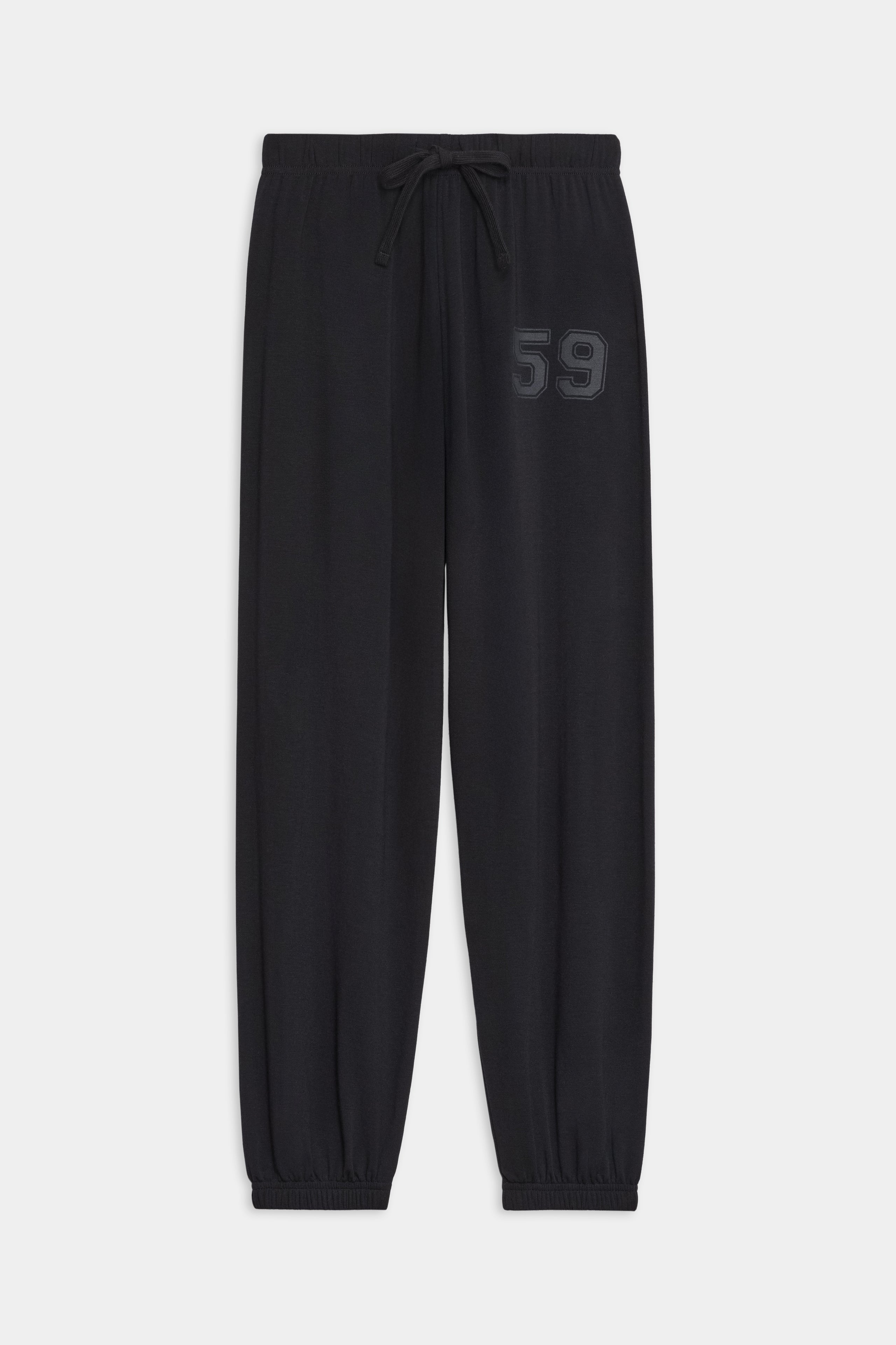 The SPLITS59 Andie Oversized Fleece Varsity 59 Sweatpant in Black features an elastic waistband, adjustable drawstring, elastic cuffs, and "59" embroidery—crafted in Los Angeles for cool weather workouts.