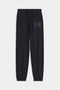 The SPLITS59 Andie Oversized Fleece Varsity 59 Sweatpant in Black features an elastic waistband, adjustable drawstring, elastic cuffs, and "59" embroidery—crafted in Los Angeles for cool weather workouts.