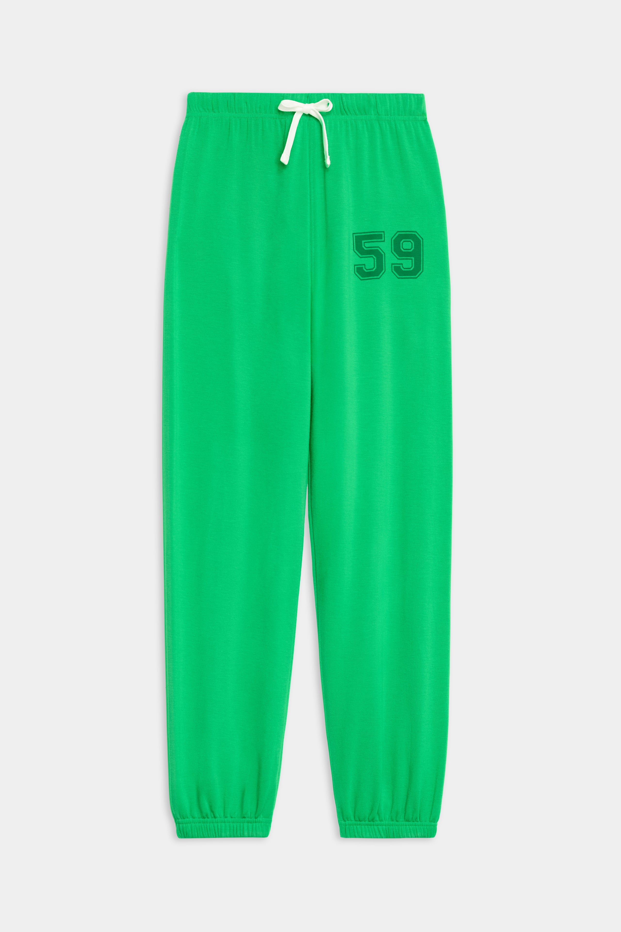The SPLITS59 Andie Oversized Fleece Varsity 59 Sweatpant in Grass features an elastic waistband, white drawstring, elastic cuffs, and "59" on the left thigh—perfect for cool weather workouts.