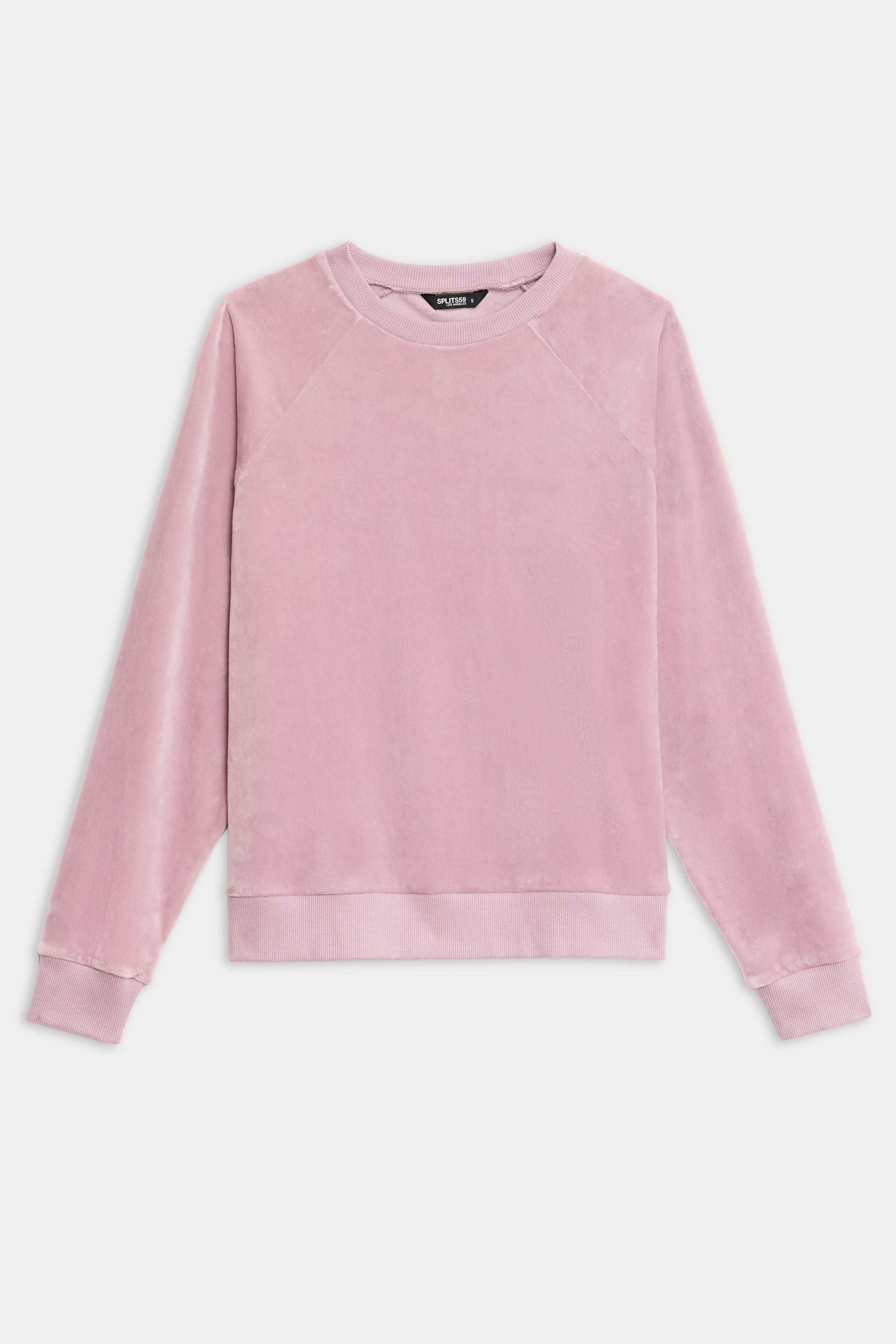 The SPLITS59 Joy Velour Crewneck, a light pink long-sleeve sweatshirt, is displayed laid flat on a white background.