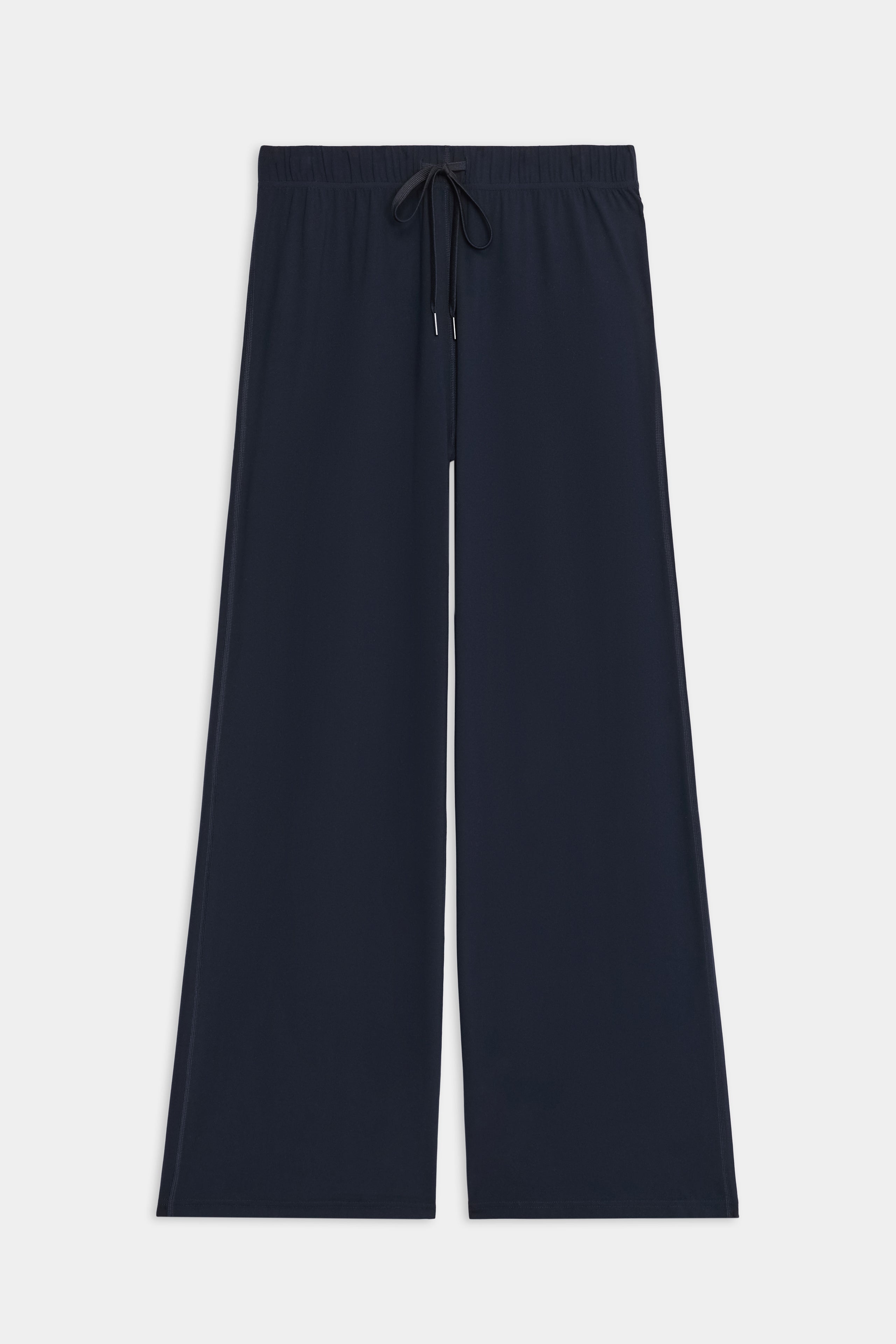 The SPLITS59 Brynn Airweight Pant in Indigo features a wide-leg silhouette, comfortable nylon-spandex blend, elastic waistband with drawstring, and is shown on a white background.