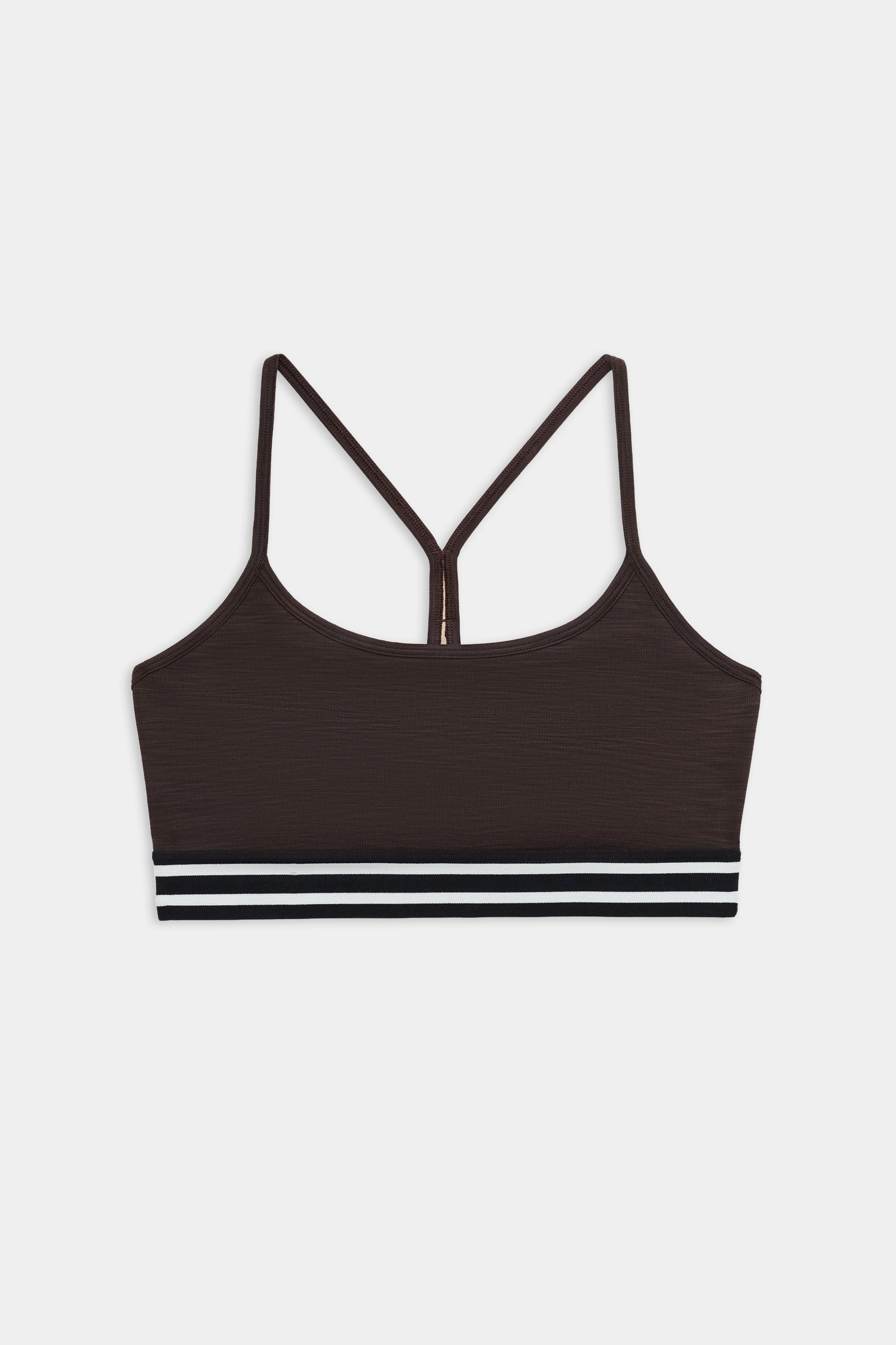 The SPLITS59 Cali Active Rib Bra in Heather Dark Chocolate features thin straps, a racerback design, and a black and white striped elastic band for stylish support during workouts.