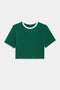 The SPLITS59 Djuna Crop Ringer in Arugula/White is a green short-sleeve crop top featuring white trim on the neckline, ideal for outdoor workouts.