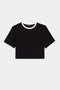 The Djuna Crop Ringer by SPLITS59 is a black short-sleeve crop top with a white crew neck collar, ideal for CrossFit or gym workouts.