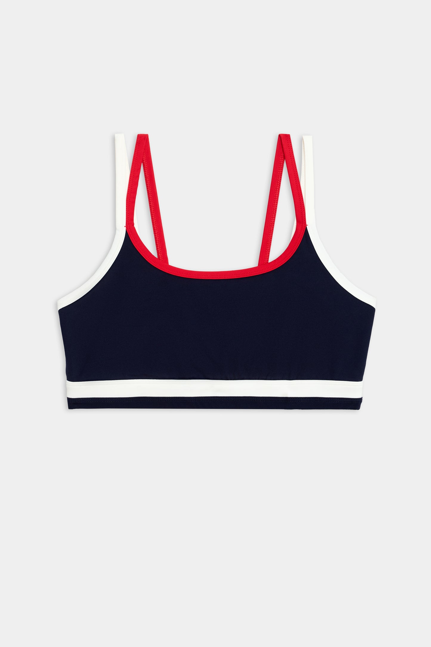 The SPLITS59 Eva Rigor Double Strap Bra in Indigo/White features contrast color accents and double red straps, shown on a plain background—perfect for gym workouts.