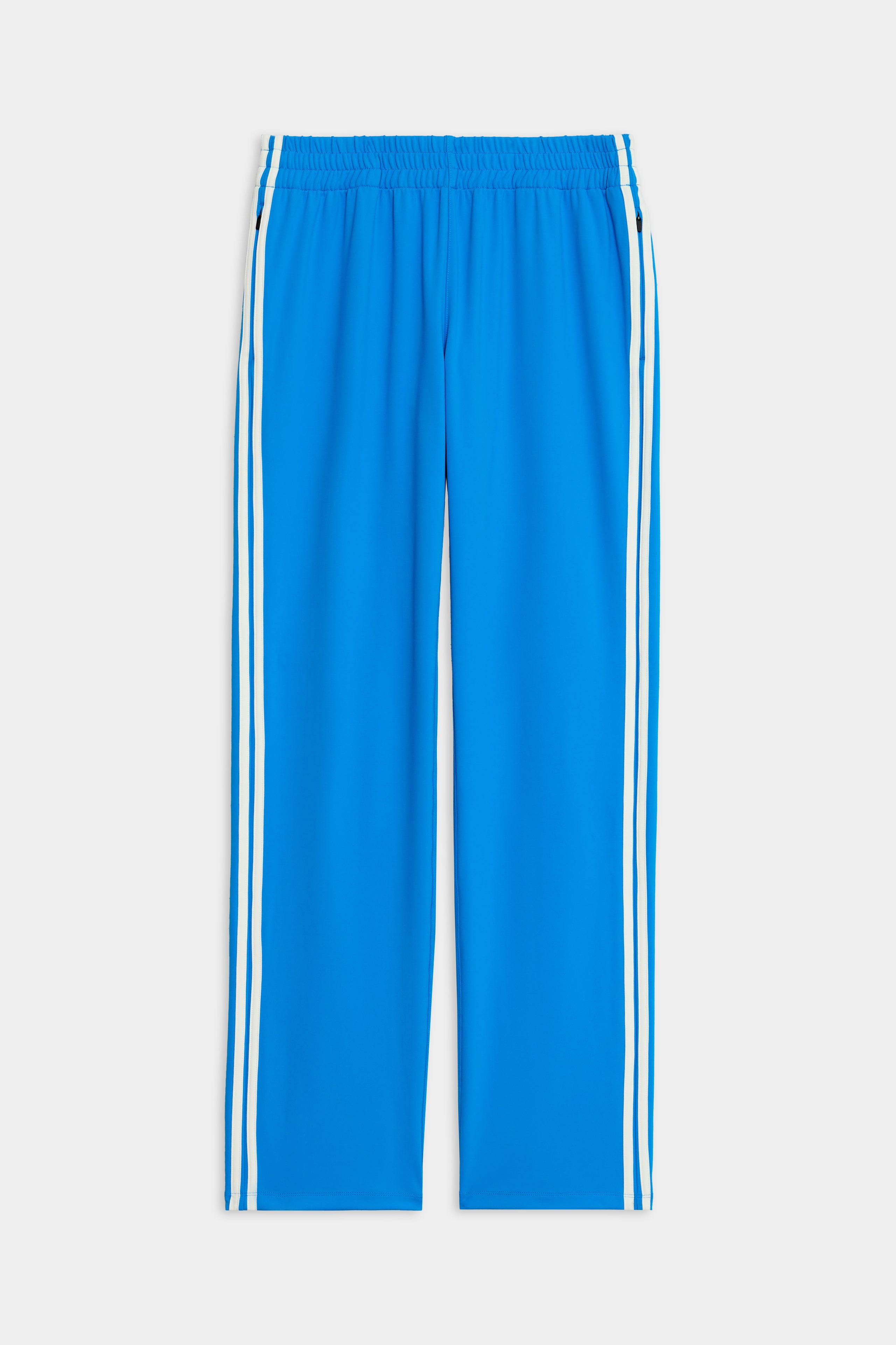 The SPLITS59 Fox Recycled Techflex Pant in Riviera/White features a wide-leg fit, elastic waistband, and two vertical white stripes—perfect for a sporty look during outdoor workouts.