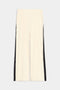 The SPLITS59 Luca Airweight Trouser with Stripe in Creme/Black, made from ultra luxe Airweight fabric, showcases black side stripes, an elastic waistband, and convenient side pockets against a plain background.