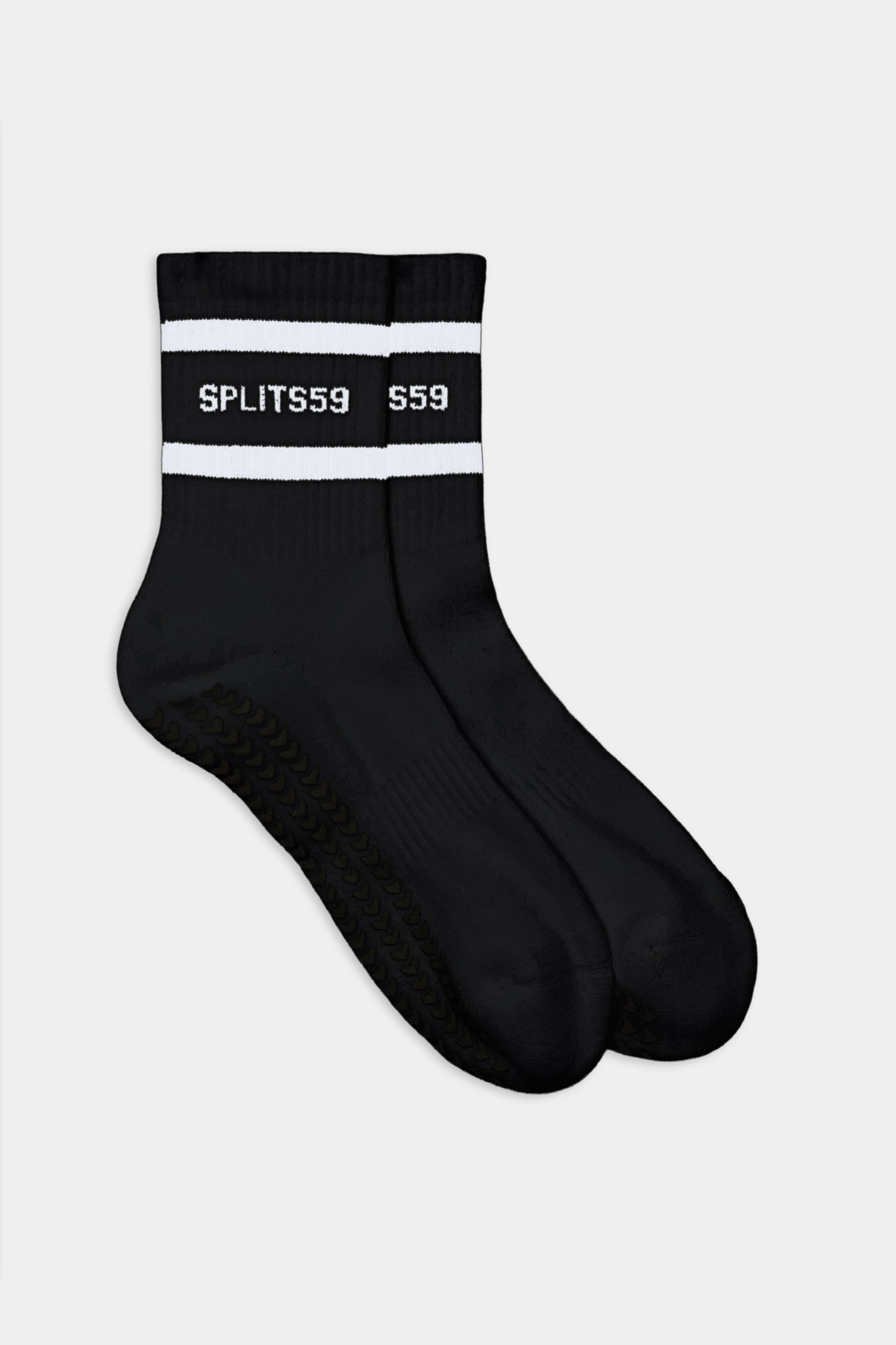 A pair of SPLITS59 Logo Strip Ankle Socks With Grip in black with white stripes and "SPLITS59" text on the cuffs, shown against a plain white background.