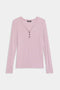 The SPLITS59 Louise Rib Henley is a light pink, long-sleeve shirt with a V-neckline and four front buttons, shown laid flat on a white background.