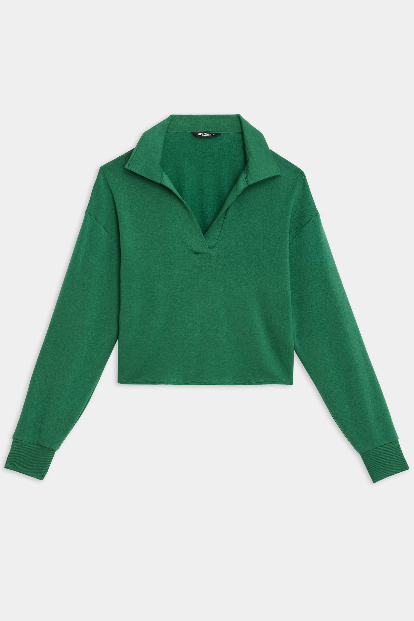 The Joan Fleece Polo Sweatshirt by SPLITS59, in Arugula, features long sleeves, a V-neck opening, and a collared design; it's showcased laid flat on a white background.